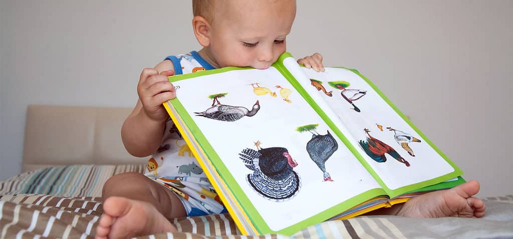 Infant with book