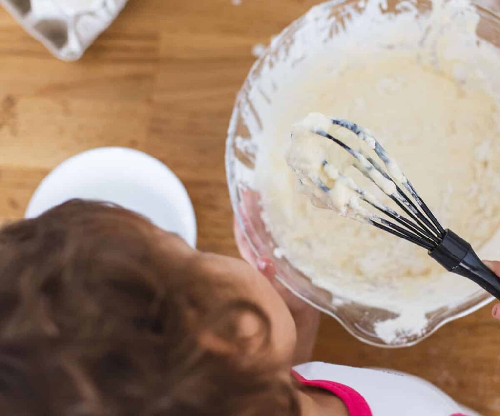 children cooking at home with their au pair